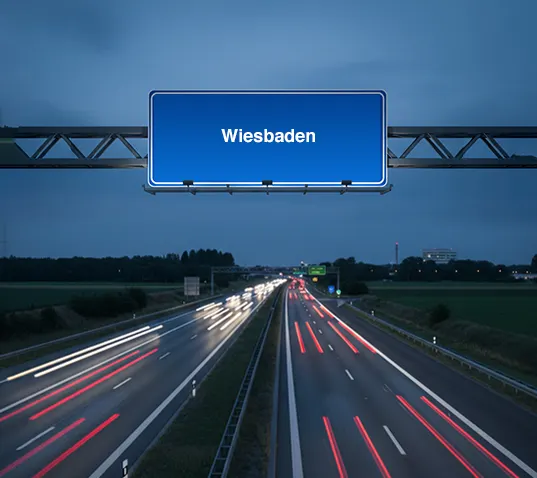 Motorway sign to Wiesbaden at dusk